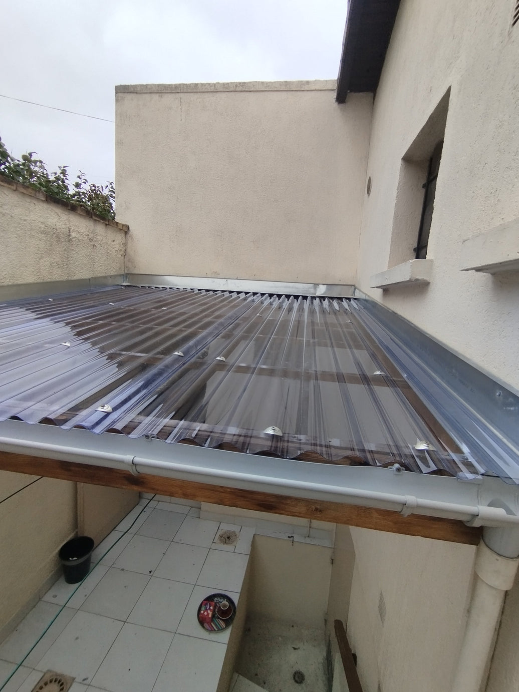 Remplacement de plaques polycarbonate et gouttière PVC à Houilles (78800)